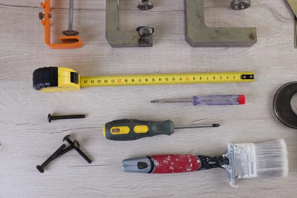 Tools for carpentry and home renovation hanging on a pegboard with copy space — Stock Photo, Image