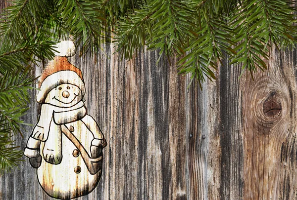 Jul bakgrund snögubbe på trä Stockfoto