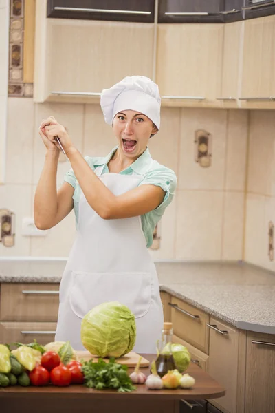 Girl chef and knife — Stock Photo, Image