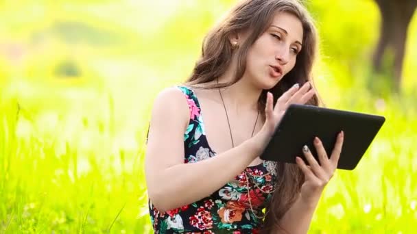 Girl talking through the tablet — Stock Video