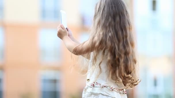 Little girl with telephone — Stock Video