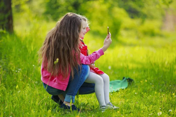 mom and daughter take a selfie