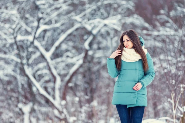 Girl on the background of snowy trees — Stock Photo, Image