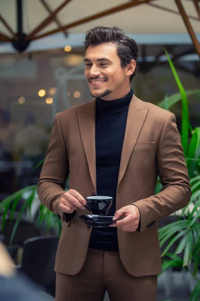 A man in a business suit drinking tea — Stock Photo, Image