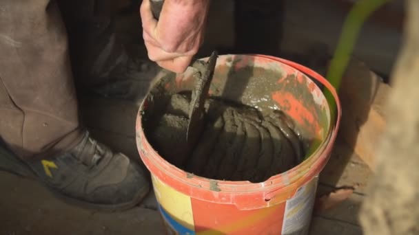 A bucket of cement mortar close up — Stock Video