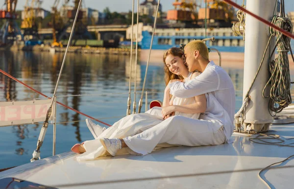 Couple sitting on a yacht — Stock Photo, Image