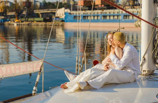 Couple sitting on a yacht — Stock Photo, Image