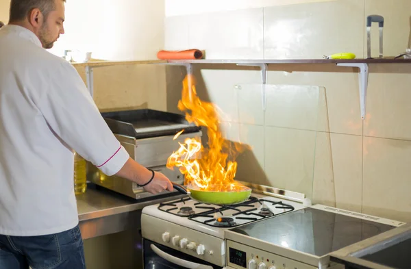 Fire in a frying pan — Stock Photo, Image