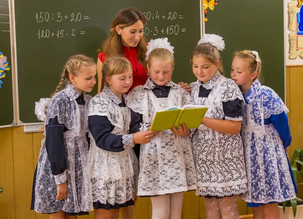 Schoolchildren near blackboard — Stock Photo, Image