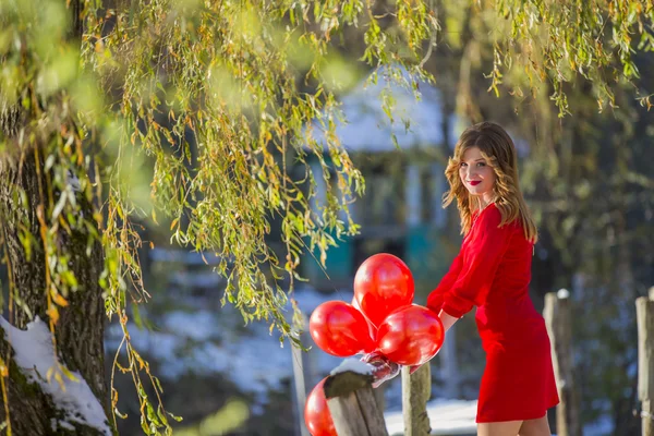 Girl with balloons — Stock Photo, Image