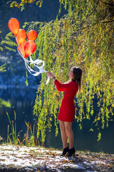 Girl with balloons — Stock Photo, Image