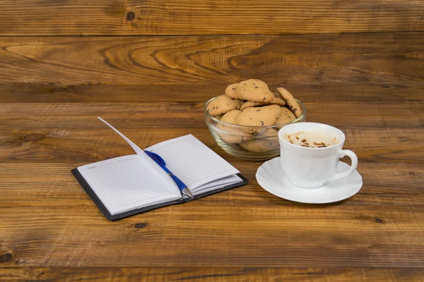 Notebook coffee and cookies — Stock Photo, Image