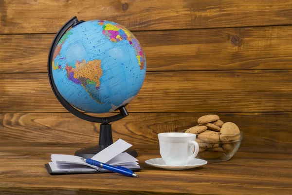 Globe coffee and notebook — Stock Photo, Image