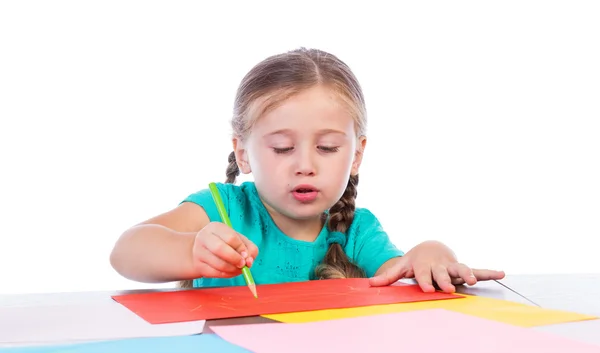 Menina desenha na mesa — Fotografia de Stock