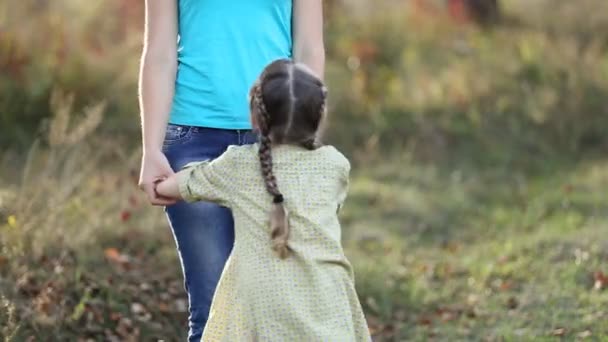 Child jumping holding hands — Stock Video