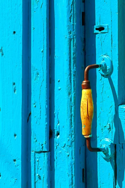 Blue wooden door and yellow handle — Stock Photo, Image