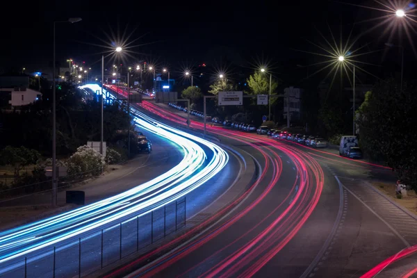 car streak lights at night near the airport of Faro city