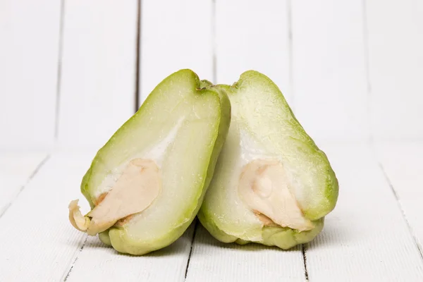 Chayote fruits on white wood background — Stock Photo, Image