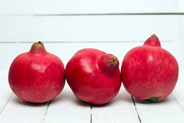 Fresh pomegranate fruits on white — Stock Photo, Image