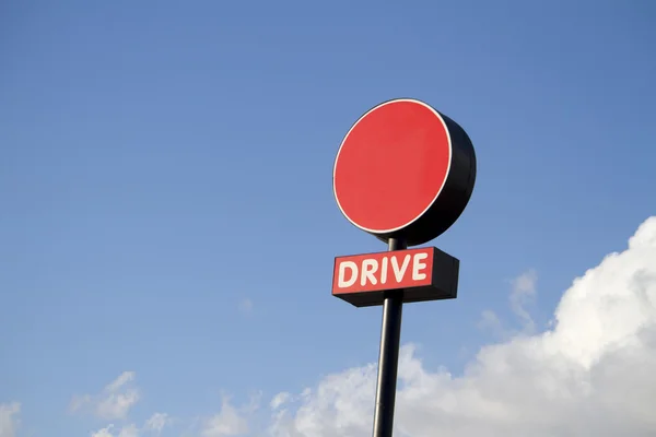 Round sign of a drive through fast food restaurant — Stock Photo, Image