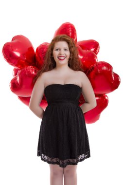 Kırmızı balonlar arasında mutlu genç kız