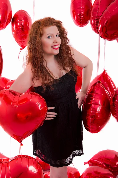 Feliz joven chica entre globos rojos —  Fotos de Stock