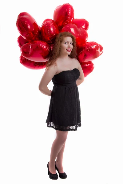 Heureuse jeune fille entre les ballons rouges — Photo