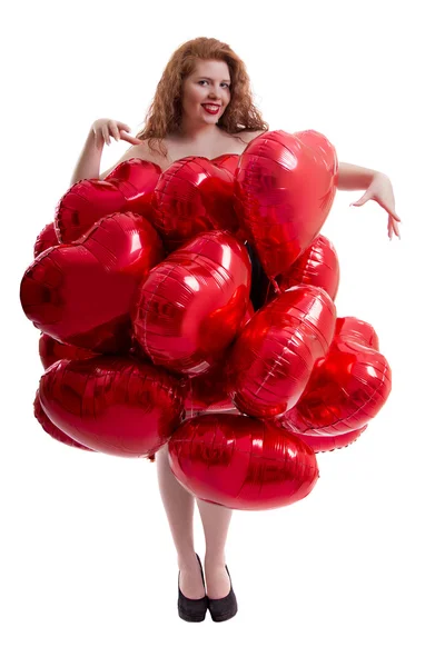 Menina feliz entre balões vermelhos — Fotografia de Stock