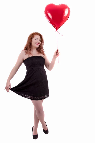 Szczęśliwa młoda dziewczyna trzyma czerwony balonik — Zdjęcie stockowe