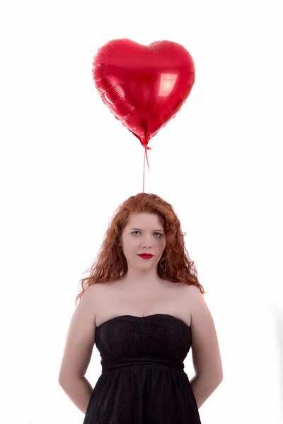 Gelukkig jong meisje houdt van een rode ballon — Stockfoto