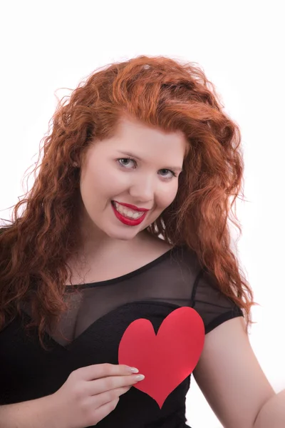 Menina feliz com um coração vermelho — Fotografia de Stock