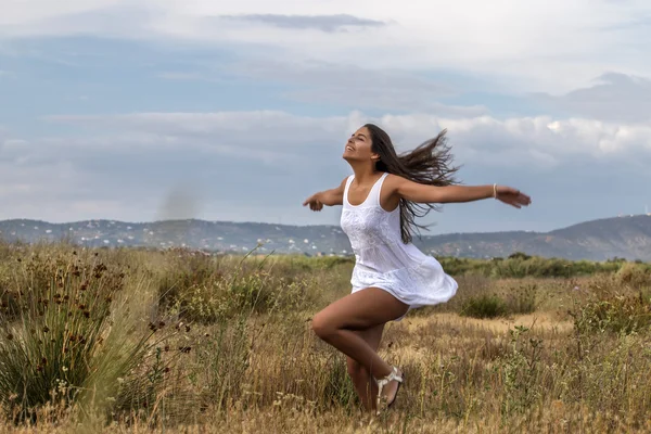 Beautiful woman on a white dress — Stock Photo, Image