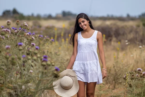 Beautiful woman on a white dress — Stock Photo, Image