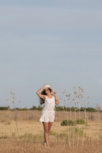 Beautiful woman on a white dress — Stock Photo, Image