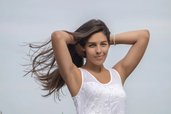 Beautiful woman on a white dress — Stock Photo, Image