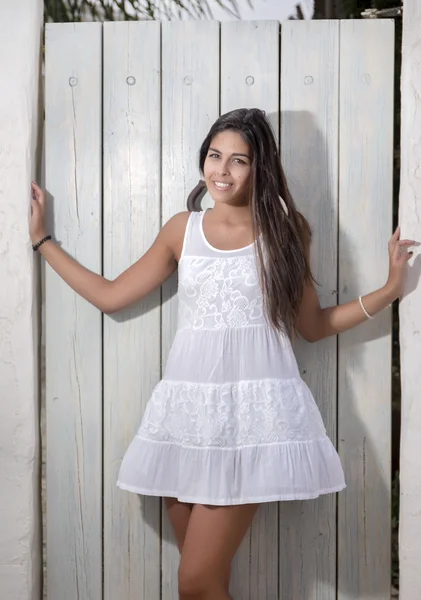 Beautiful woman on a white dress — Stock Photo, Image