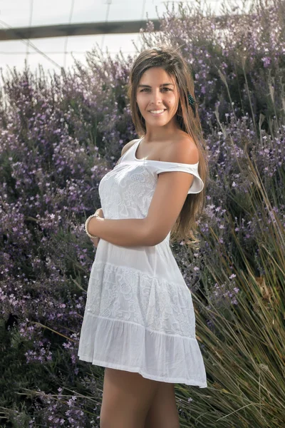 Beautiful woman on a white dress — Stock Photo, Image