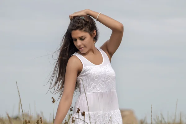 Beautiful woman on a white dress — Stock Photo, Image