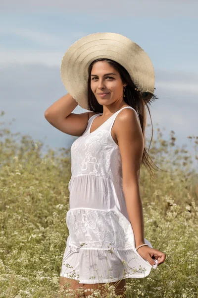 Beautiful woman on a white dress — Stock Photo, Image