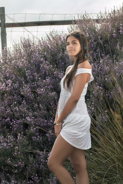 Beautiful woman on a white dress — Stock Photo, Image