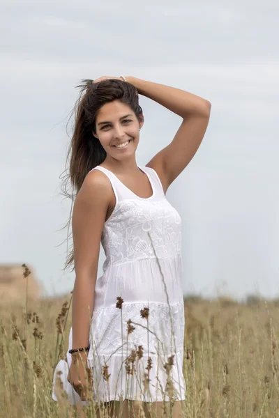 Beautiful woman on a white dress — Stock Photo, Image