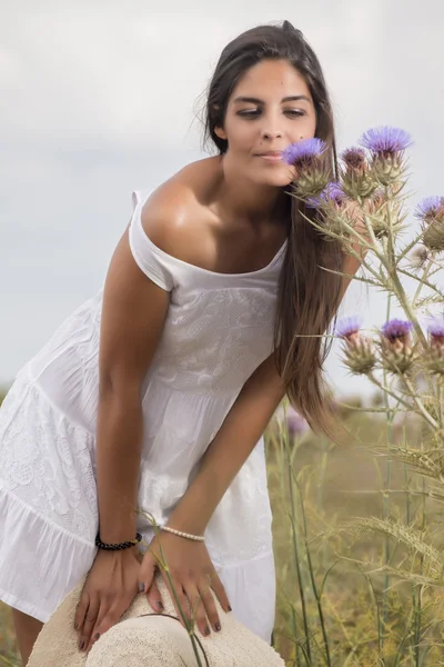 Beautiful woman on a white dress — Stock Photo, Image