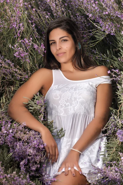 Beautiful woman on a white dress — Stock Photo, Image