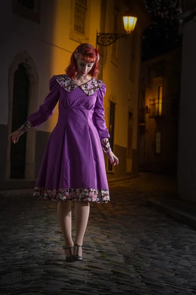 Young redhead girl on a retro vintage dress — Stock Photo, Image