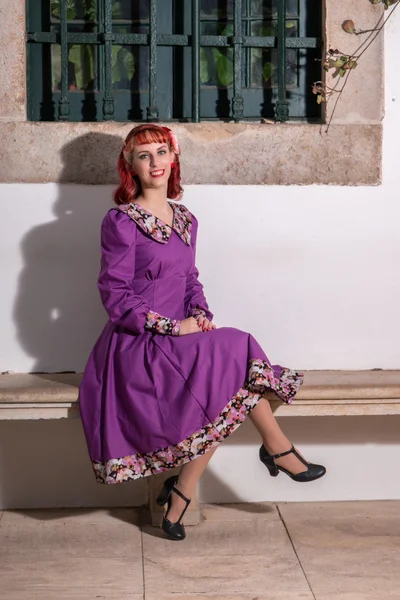 Young redhead girl on a retro vintage dress — Stock Photo, Image