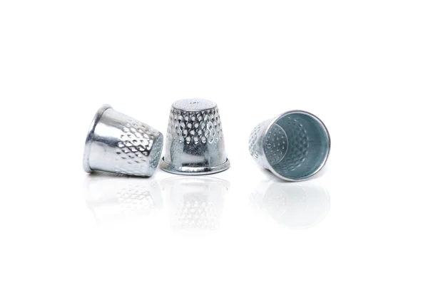 Three silver thimbles isolated — Stock Photo, Image