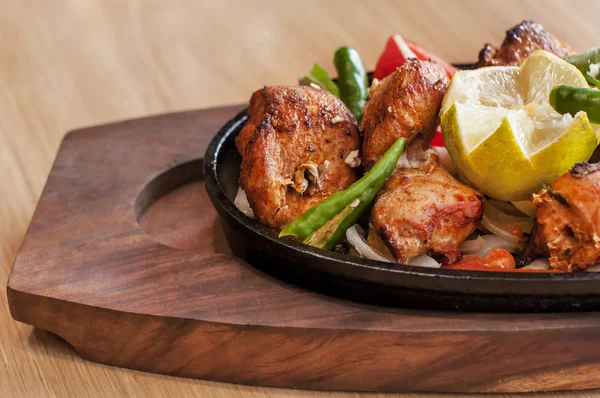 Food grilled chicken pieces on a dish Stock Picture