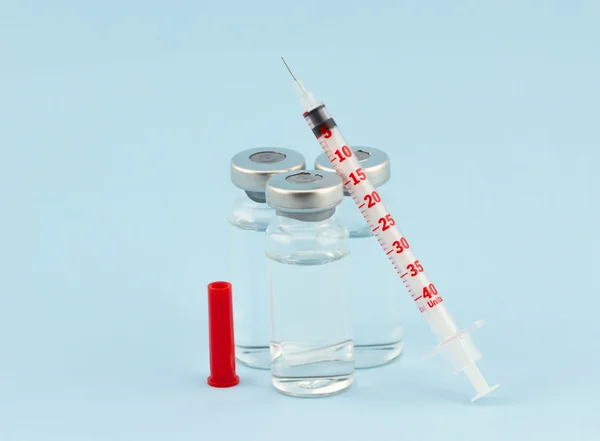 Medical ampoules and one red insulin — Stock Photo, Image