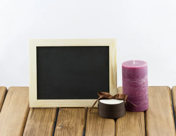 Purple candle and gift box — Stock Photo, Image