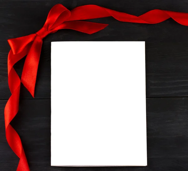 White list of paper with red ribbon — Stock Photo, Image